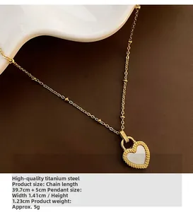Macro view of gold titanium heart necklace with white mother-of-pearl inlay detail