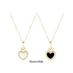 Reversible heart pendant necklace with white shell and black enamel in gold finish
