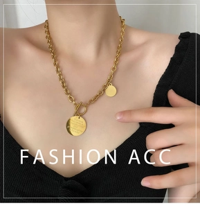 Detail of gold titanium toggle necklace with engraved grandmother granddaughter pendant
