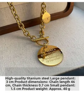 Close-up of gold titanium necklace with engraved round pendants and OT buckle