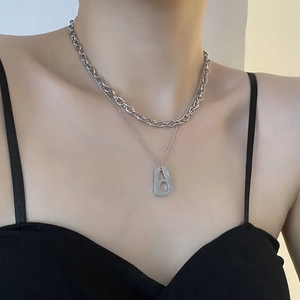 Double-layered silver necklace with geometric cutout pendant and cuban link chain for men