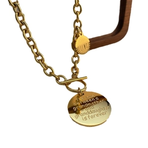 Gold OT toggle chain necklace with engraved grandmother and granddaughter love pendant