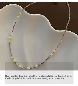 Detail of beaded necklace with purple stones, pearls, and titanium steel clasp and length data