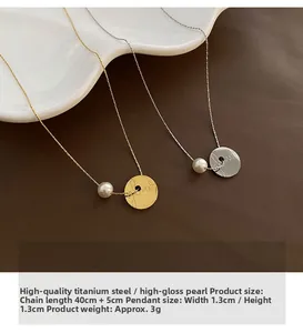 Detailed close-up of gold and silver coin necklaces with shiny shell pearls and engravings