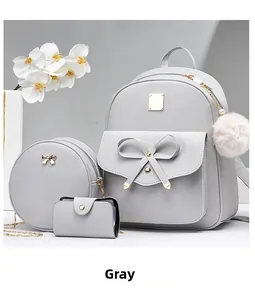 Three-piece grey PU leather backpack set with crossbody bag and pompom charm