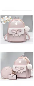 Detailed view of pink PU leather backpack set with bow decoration and pearl accents