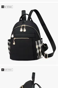 Detail view of black nylon backpack showing side checkered pocket and back straps