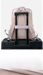 Detail of pink oxford fabric backpack with a luggage strap for travel convenience