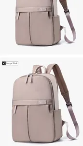Detailed side view of large pink travel backpack with pleated pocket and brand logo