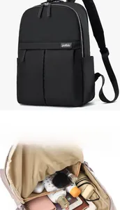 Detail view of black nylon backpack interior showing large capacity and multi-layer storage