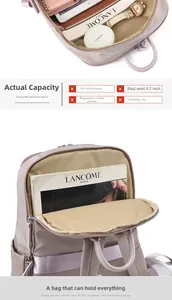 Detail view of large capacity backpack interior showing storage for iPad and umbrella