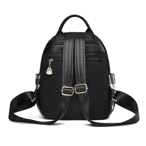 Black Oxford backpack for women featuring plaid side pockets and gold-tone zippers