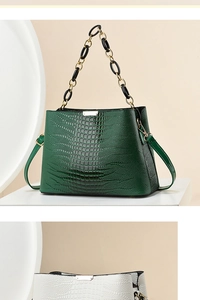 Detail of crocodile pattern leather bags with golden metal and resin chain straps