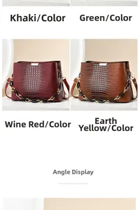 Detail view of stylish crocodile pattern handbags in wine red and khaki finishes