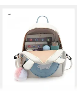 White leather mini backpack with cute bunny ears showing spacious internal storage capacity