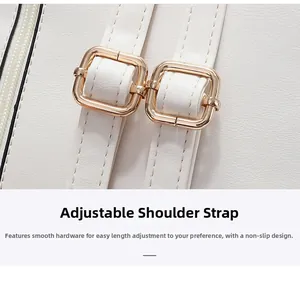 Detail of adjustable white PU leather straps with light gold buckles on a mini backpack