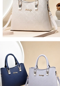 Detail of high-capacity handbags in crocodile texture and embossed patterns with gold hardware
