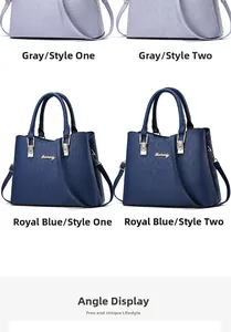 Detail showing crocodile texture and embossed patterns on large tote bags in grey and blue