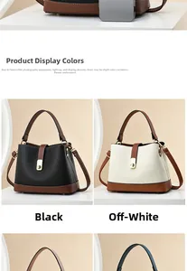 Close-up of litchi grain leather handbags in black and beige with gold metal buckles