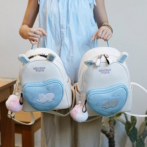 Mini rabbit ear backpack with blue heart pocket and plush ball keychain for women