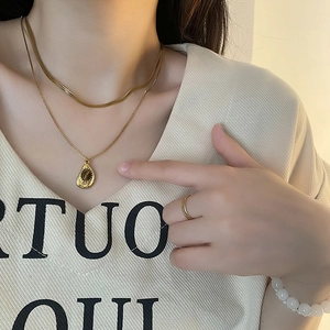 Gold layered necklace with teardrop pendant, gold ring and white bead bracelet set