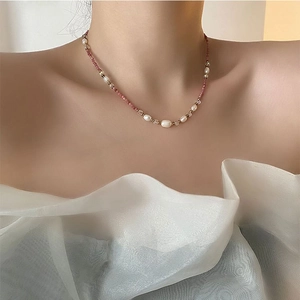 Bohemian pearl and pink natural stone beaded necklace worn on a female model