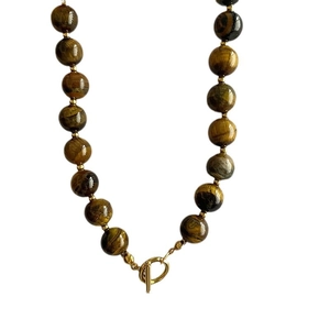 Natural tiger eye beaded necklace featuring a golden OT toggle clasp and spacer beads