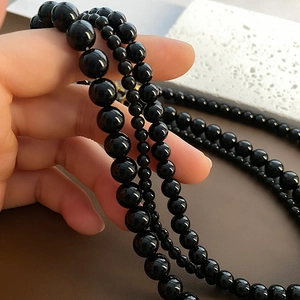 Polished black beaded multilayer necklace with Fu character titanium steel pendant