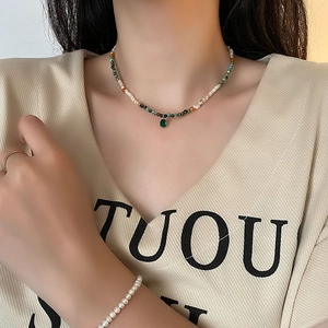 New Chinese shell agate necklace with pearls and green gemstones on female model