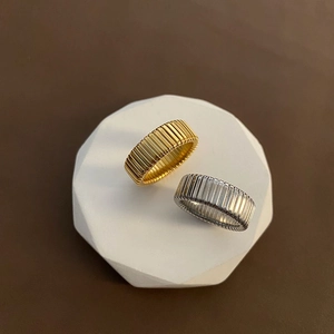 Minimalist wide snake bone rings in gold and silver finish with vertical ribbed texture