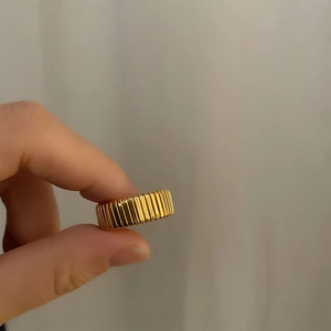 Minimalist gold titanium steel stretch wide snake bone ring with vertical ribbed texture