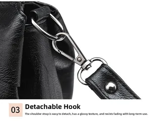 Detail view of the durable silver metal clasp and textured black leather on the shoulder bag