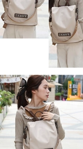 Dettaglio dello zaino antifurto beige con spallacci jacquard e manico in pelle