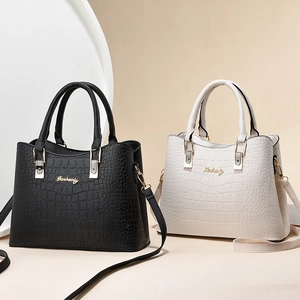 Large croc-effect leather tote bags in black and beige with dual handles and straps