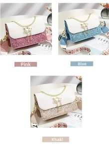 Detailed view of glitter crossbody bags in pink, blue, and khaki with pearl cat charms