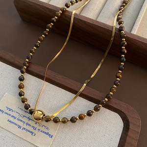 Double-layered tiger eye stone and golden snake chain necklace with round pendant