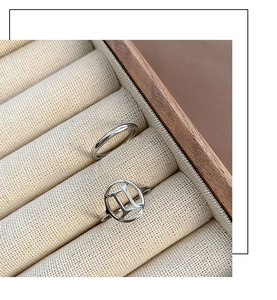 Detailed view of Gemini twin set rings with silver finish on a premium jewelry display box