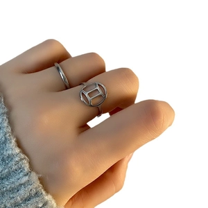 Minimalist titanium steel Gemini ring set featuring polished and hollow circular bands