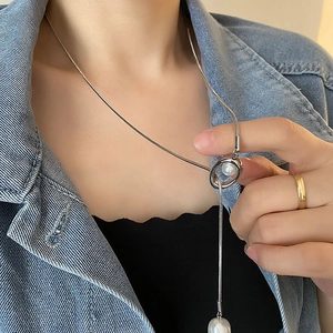Minimalist Y-shaped stainless steel necklace featuring elegant pearls on a snake chain