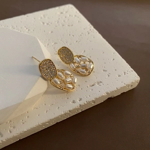 Elegant geometric gold drop earrings with pearl embellishments and pavé zircon details