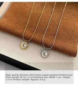 Detail view of gold and silver C-letter necklaces with 39cm plus 5cm titanium steel chain