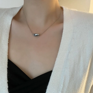 Minimalist silver geometric cylinder pendant necklace on a sleek snake chain for women