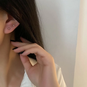 Minimalist sterling silver bead stud earrings shown on model for daily style