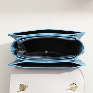 Sky blue and white crossbody bag with multi-layer interior and gold hardware