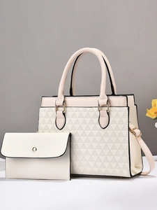 Elegant cream tote bag set with geometric triangle patterns and matching small pouch