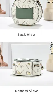 Detail view of round crossbody bag showing rear green pocket and golden bottom studs