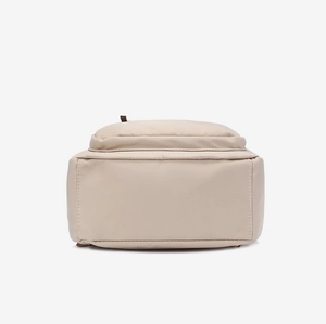 Vue du fond du sac à dos en tissu Oxford beige montrant les coutures et la texture fine