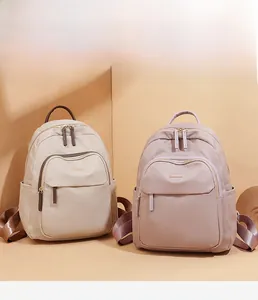 Détails de sacs à dos en tissu Oxford élégants en beige et rose avec zips dorés