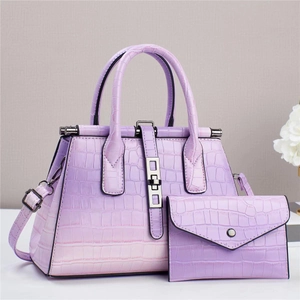 Detail of gradient purple crocodile pattern tote bag set with matching envelope wallet