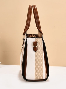 Sac fourre-tout tissé à rayures avec bordure en cuir marron et boucles dorées